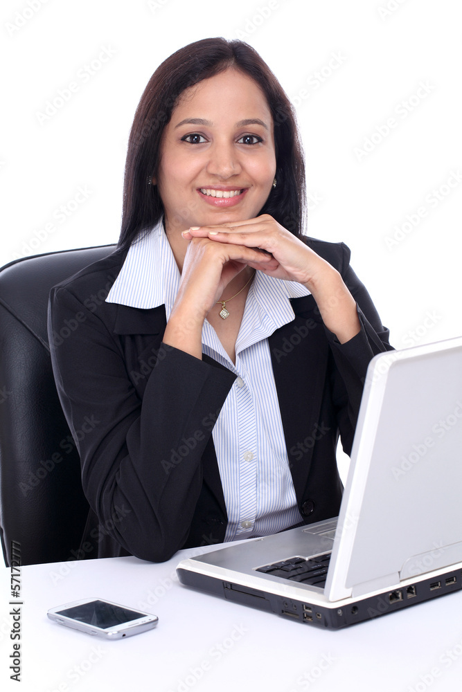 Happy young Indian business woman against white Happy young Indian business woman against white