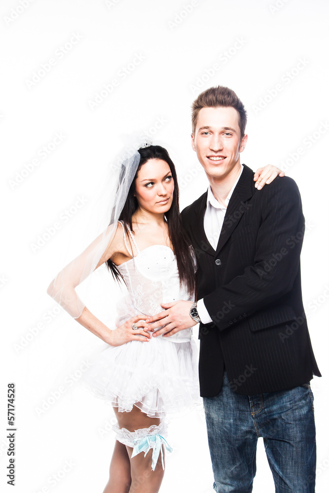 Beautiful and young married couple isolated on a white backgroun Beautiful and young married couple isolated on a white backgroun