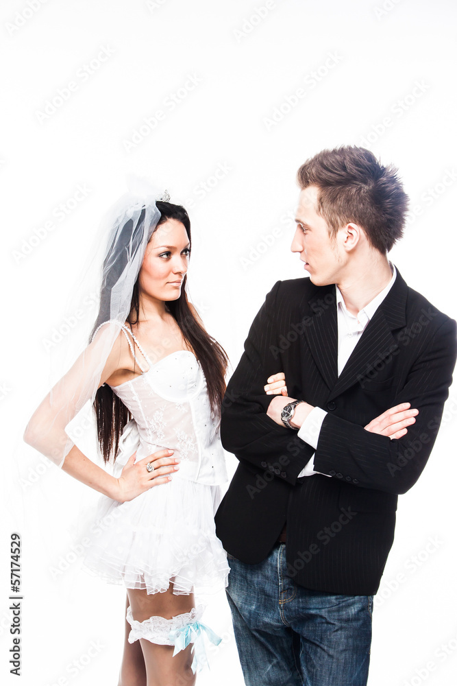 Beautiful and young married couple isolated on a white backgroun