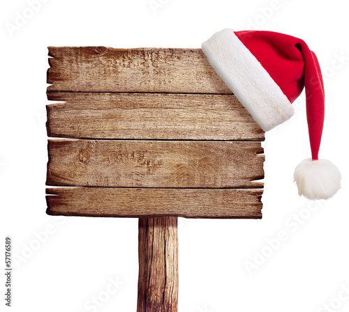 wooden sign with red Santa's hat