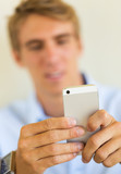 Man looking at smart phone, Texting
