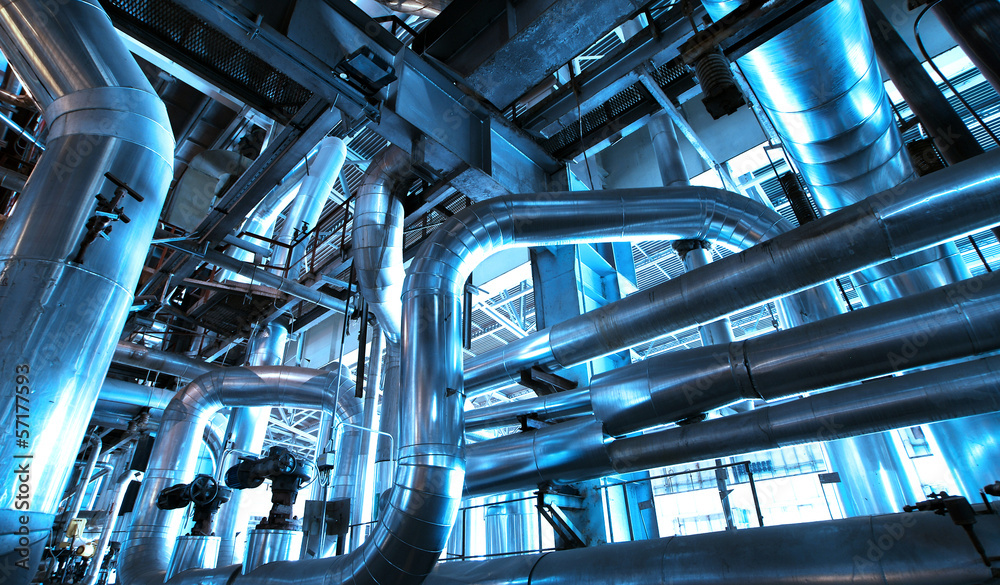 Equipment, cables and piping as found inside of  industrial powe