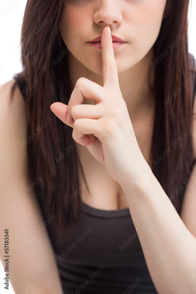 Naklejka premium Close up on cute brunette keeping secret