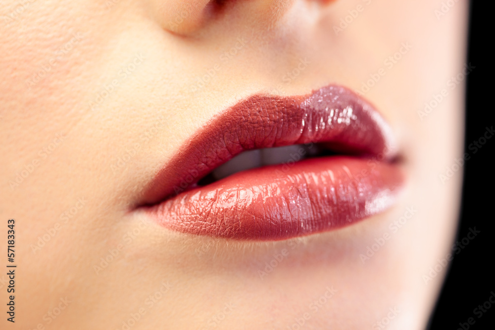 Close up on beautiful models glossy lips Close up on beautiful models glossy lips