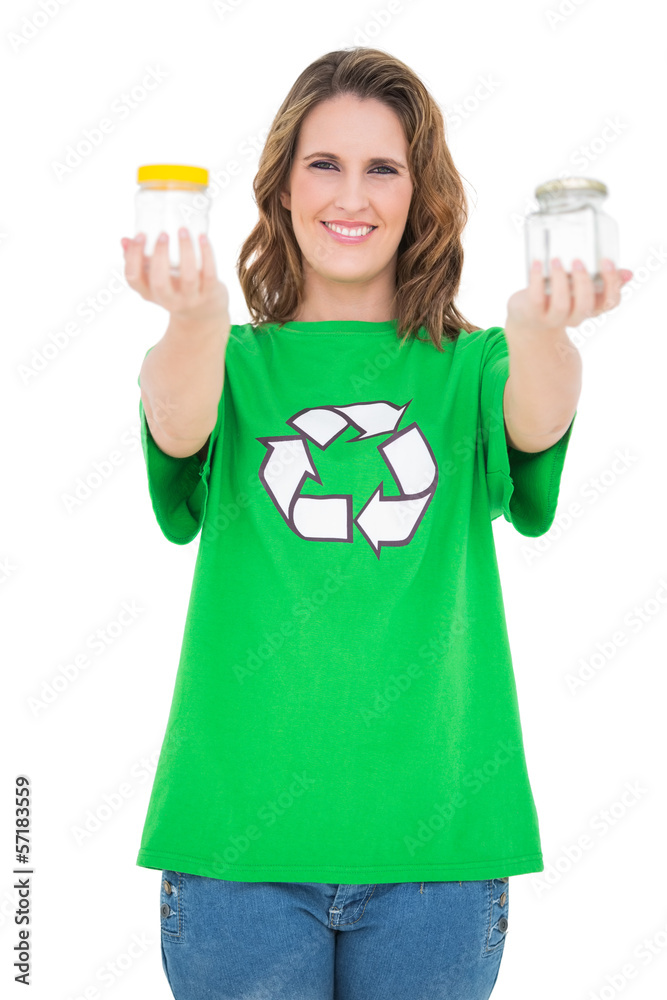 Smiling environmental activist showing pots looking at camera Smiling environmental activist showing pots looking at camera