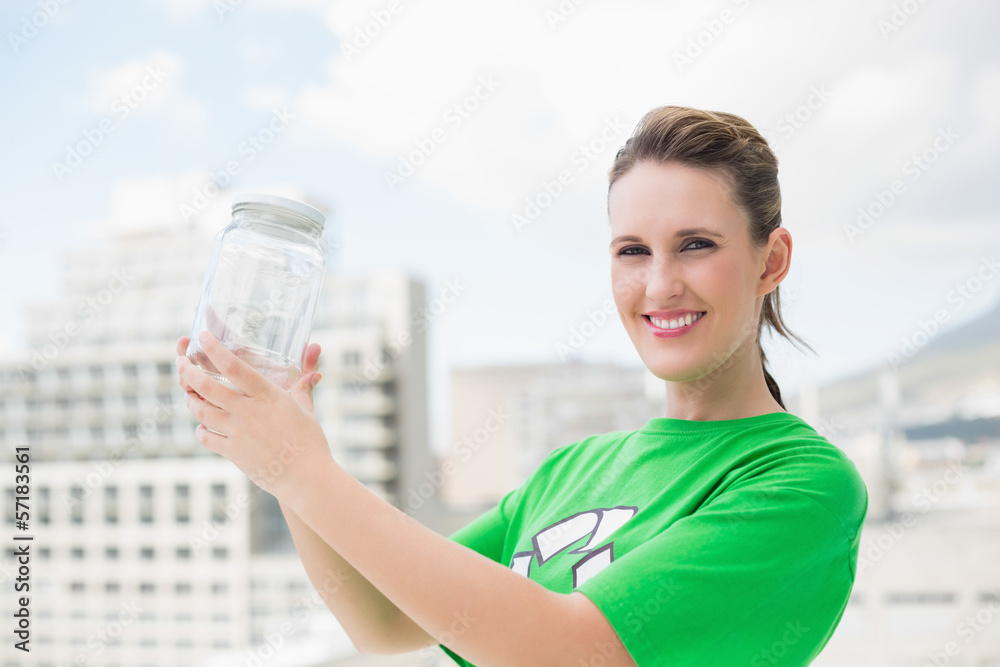 Happy environmental activist holding glass pots Happy environmental activist holding glass pots