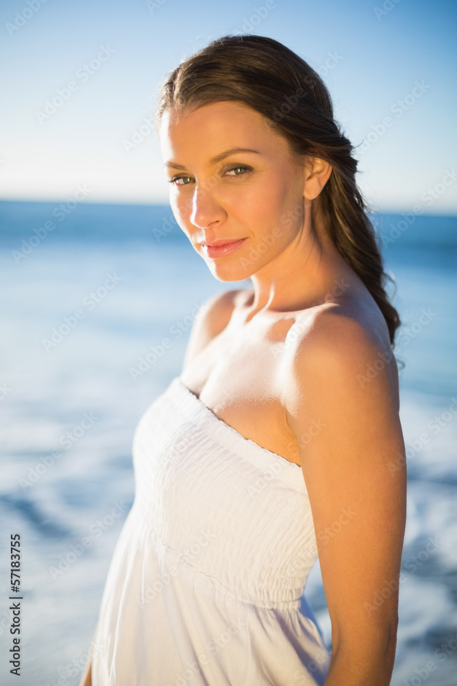Peaceful brunette in white summer dress posing Peaceful brunette in white summer dress posing