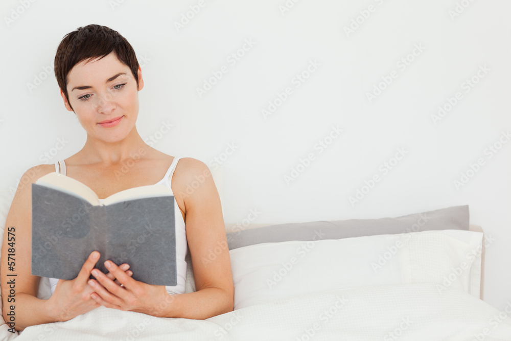 Close up of a brunette reading a book Close up of a brunette reading a book