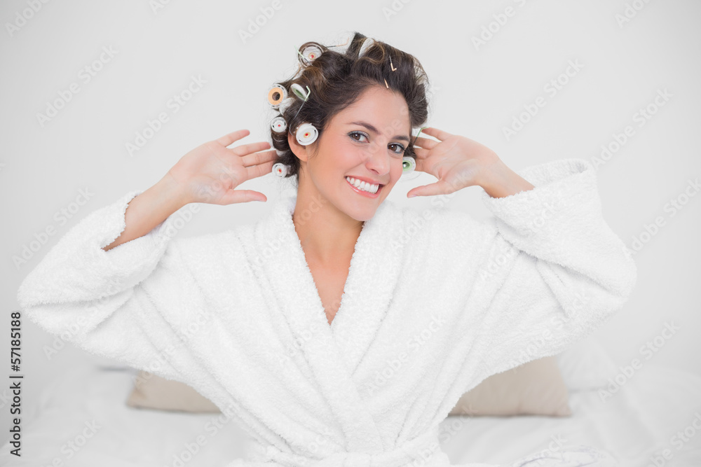 Fototapeta premium Cheery smiling brunette looking at camera