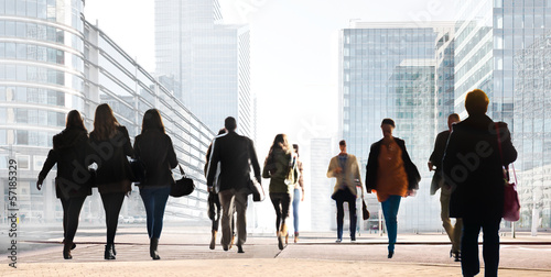 A large group of people on a light background. Panorama.