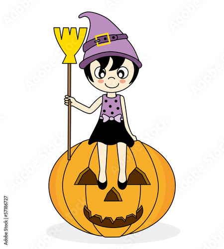 girl dressed as witch sitting on a pumpkin