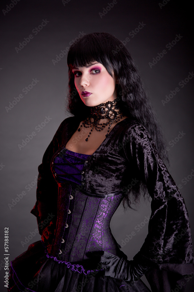 Portrait of attractive gothic girl in elegant medieval costume