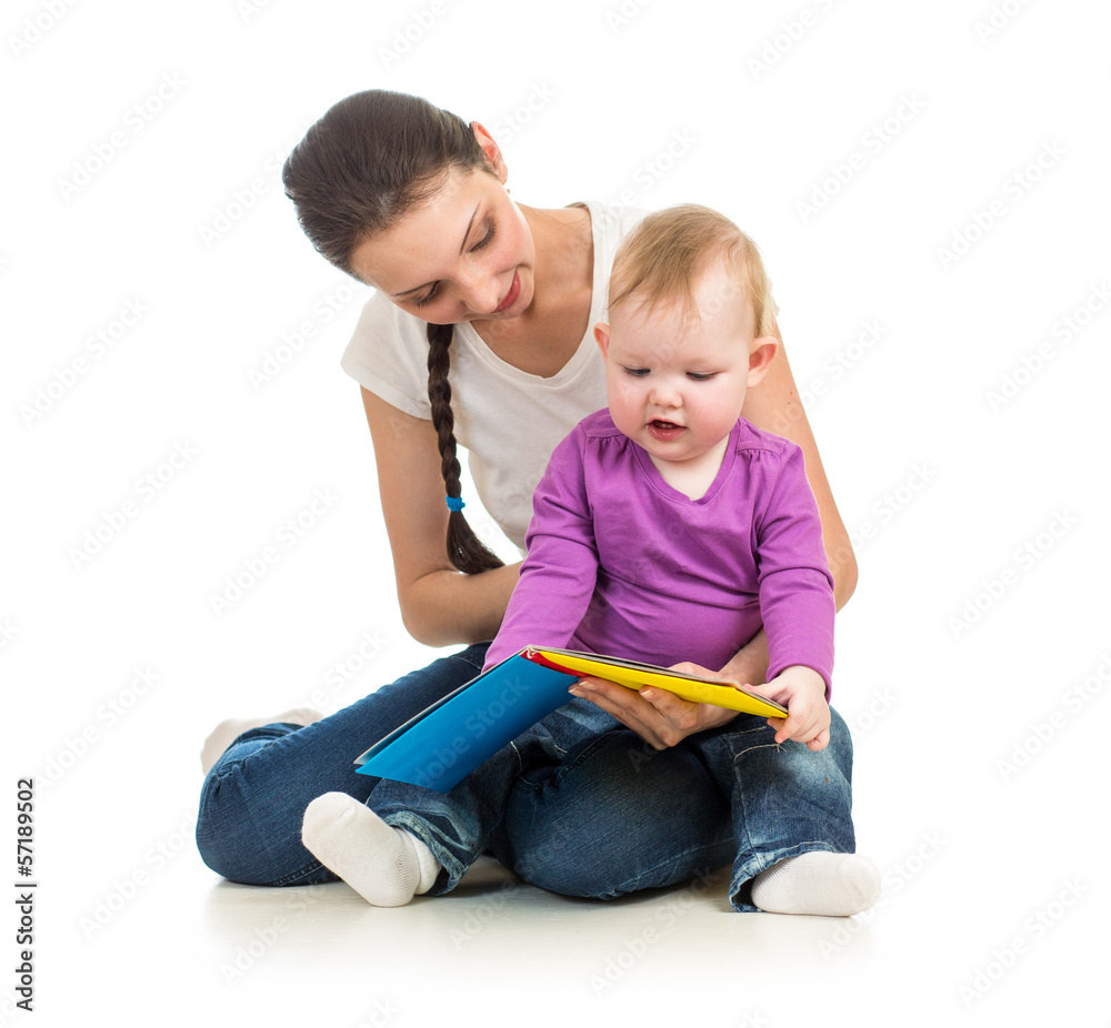 mother reading a book to her baby daughter mother reading a book to her baby daughter