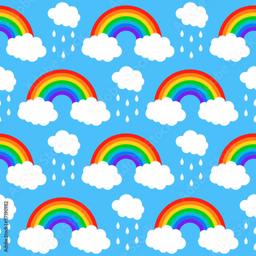 Seamless pattern with rainbows and clouds on a blue background