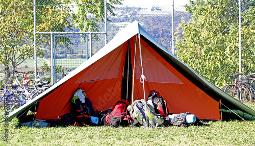 tent of boy scout camp and the rucksack put out in the open air