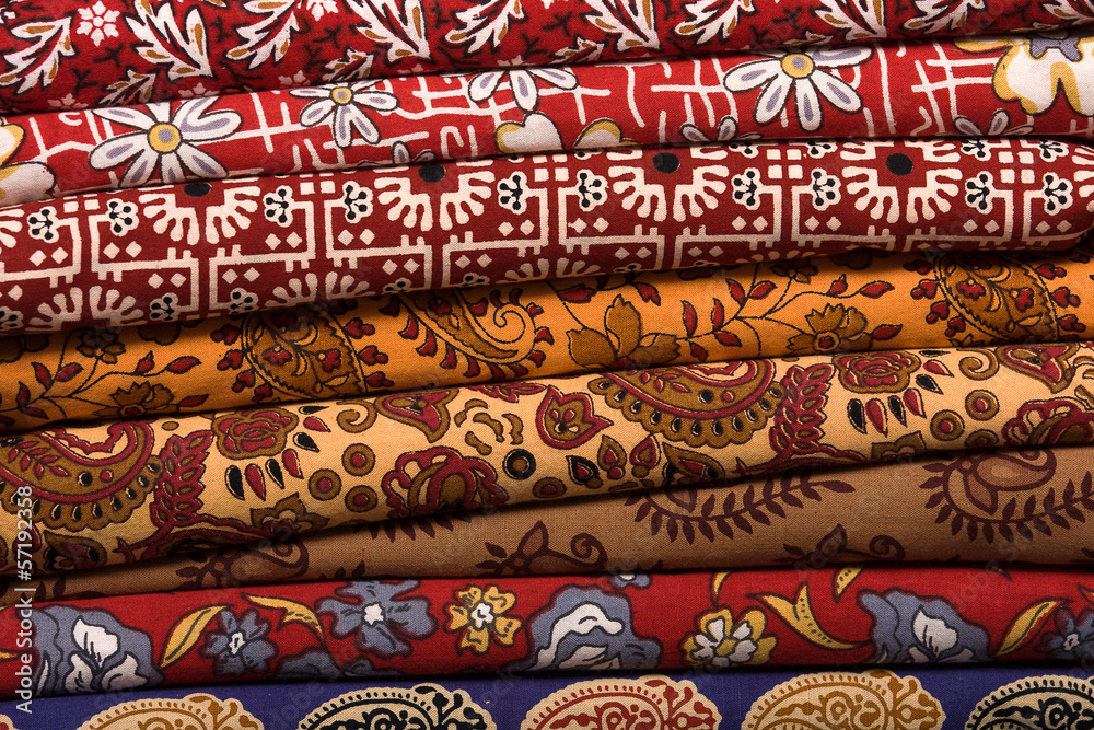 Heap of cloth fabrics at a local market in India. Close up . Heap of cloth fabrics at a local market in India. Close up .