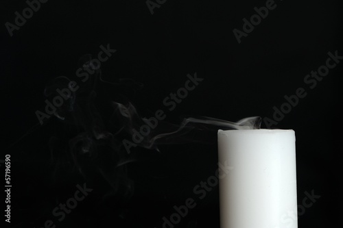 Smoke Coming from Candle on Black Background with Copy Space photo