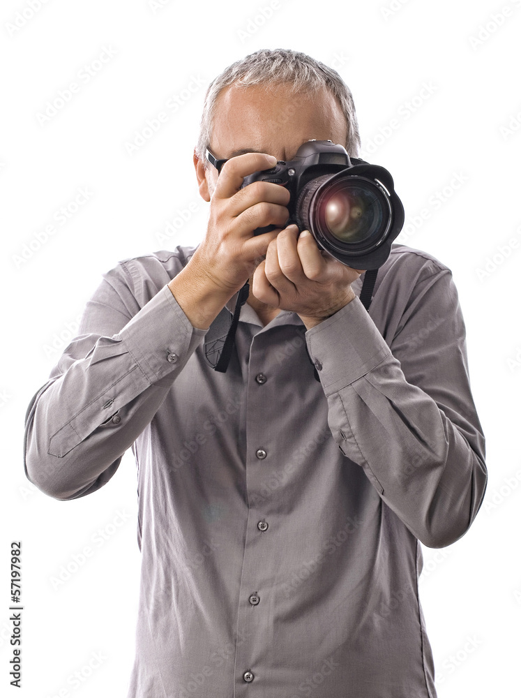 Photographer taking pictures with camera on white