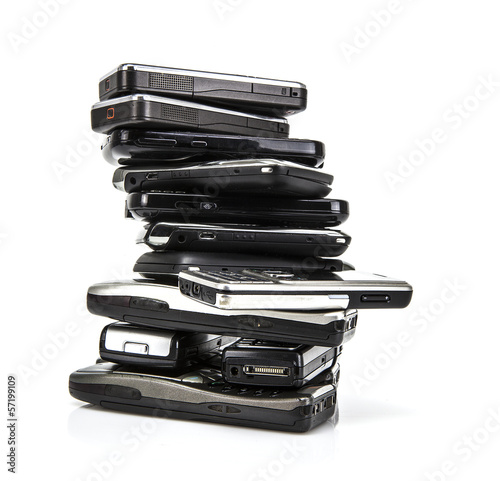 Pile of old mobile phones ready for recycling photo