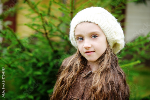 Child girl in white cap, close-up portrait