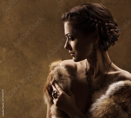 Woman in luxury fur coat, retro vintage style photo