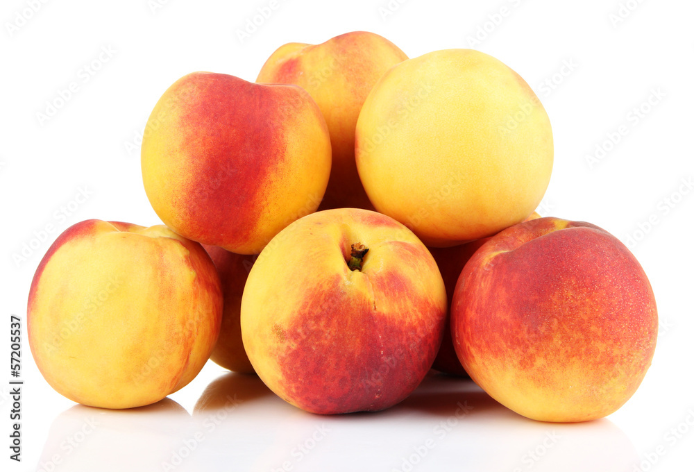Ripe sweet peaches, isolated on white Ripe sweet peaches, isolated on white