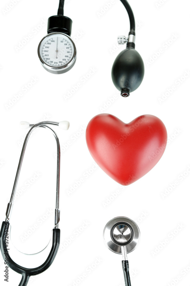 Tonometer, stethoscope and heart isolated on white Tonometer, stethoscope and heart isolated on white