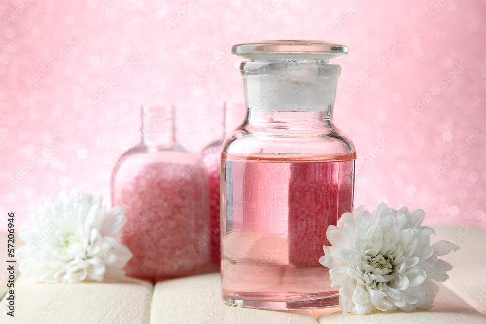 Glass bottle with color essence, on pink background Glass bottle with color essence, on pink background