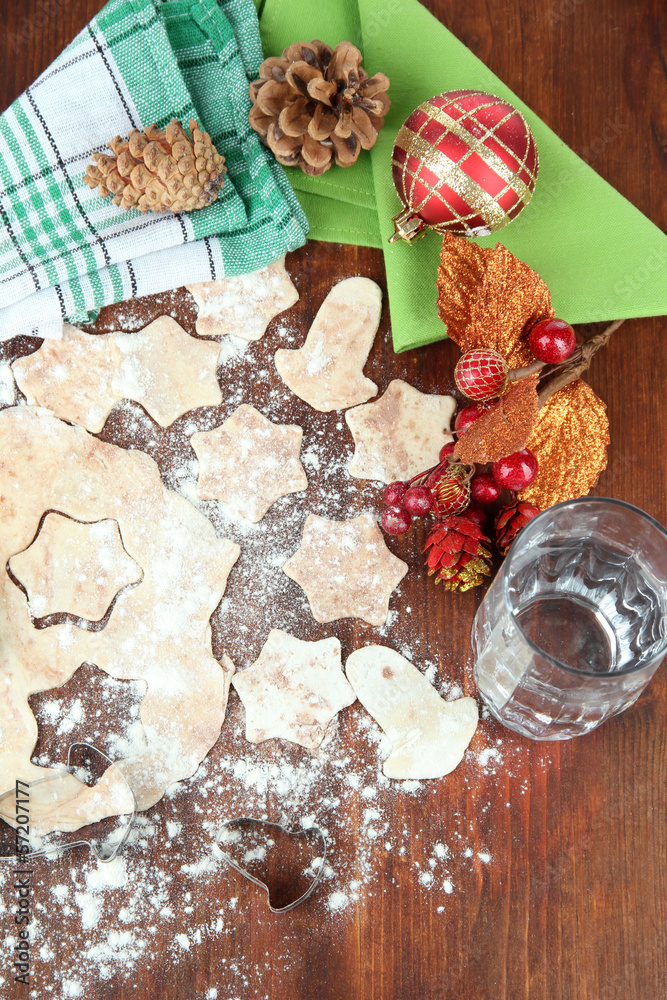 Making Christmas cookies on wooden table Making Christmas cookies on wooden table