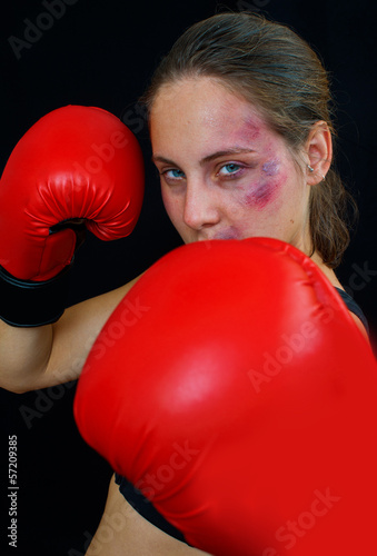 woman boxer face with bruises and gloves © bertys30