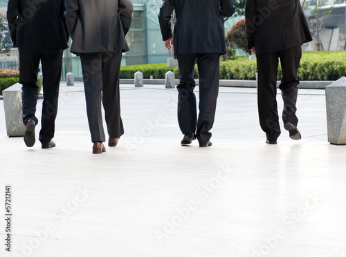 businesspeople walking together.