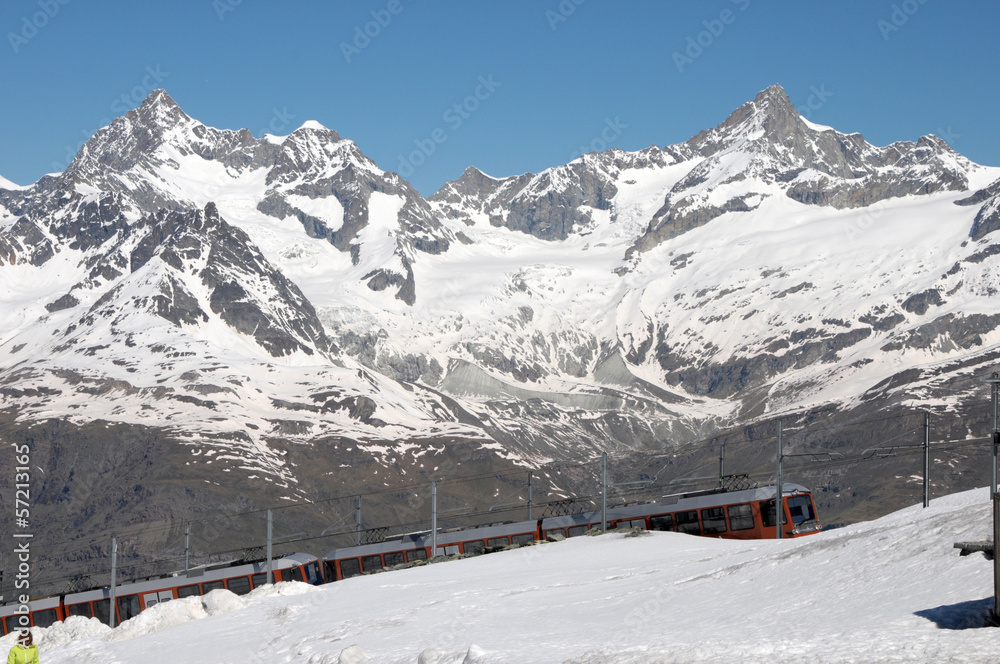 Gornergrat railway arriving at  station in Swiss Alps