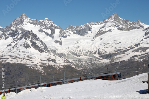 Gornergrat railway arriving at station in Swiss Alps