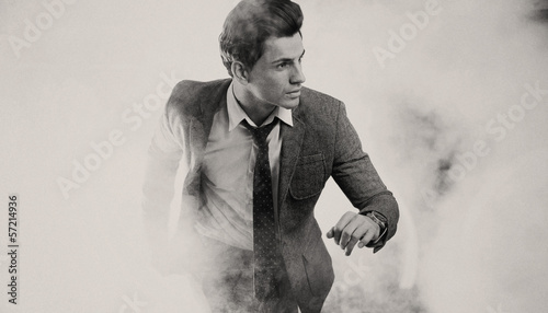 Portrait of running elegant man photo