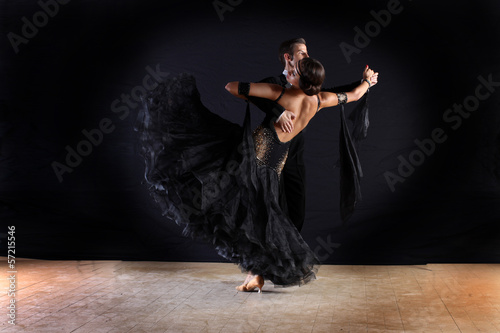 Latino dancers in ballroom isolated on black background