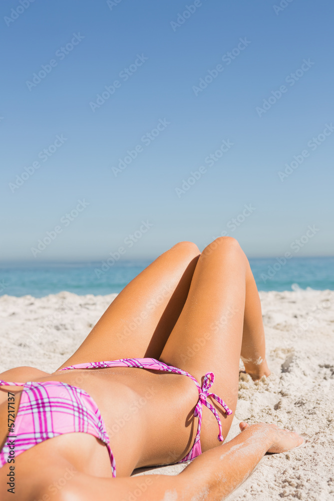 Close up of young womans body while sunbathing Close up of young womans body while sunbathing