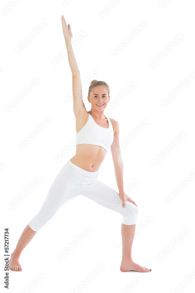 Toned smiling blonde doing yoga exercise Toned smiling blonde doing yoga exercise
