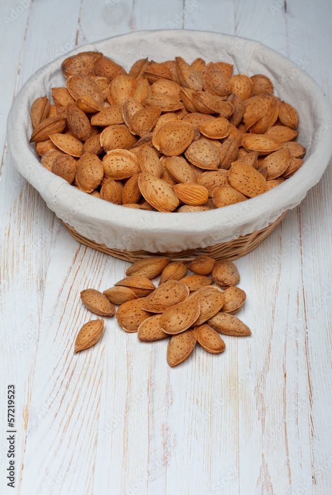Almonds in shell on wooden table still life Almonds in shell on wooden table still life
