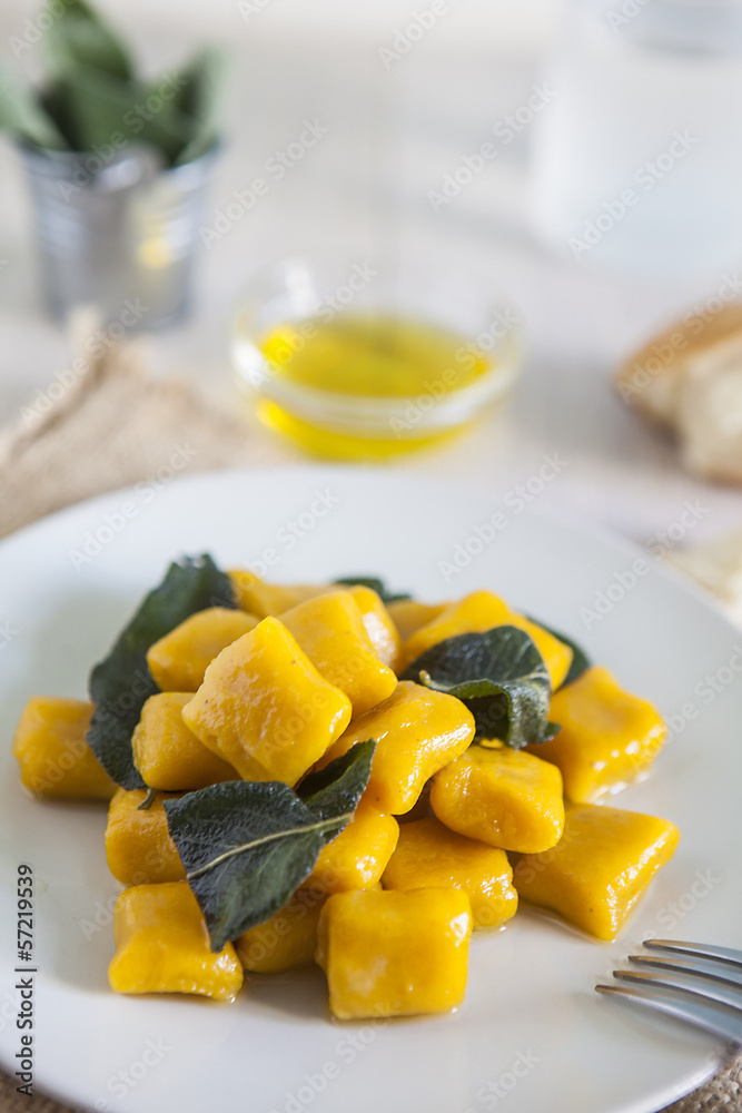 delicious pumpkin gnocchi with sage leaves and olive oil, vegan delicious pumpkin gnocchi with sage leaves and olive oil, vegan
