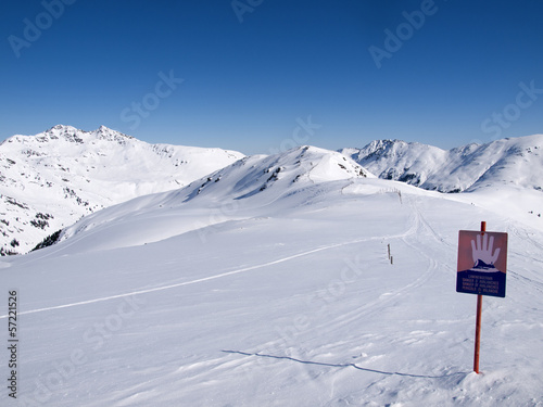 A sign in the Austrian alps wich says danger of avalanches