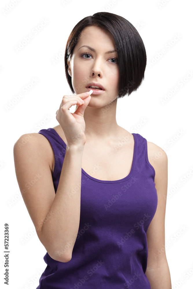 Woman takes pills, isolated on white Woman takes pills, isolated on white