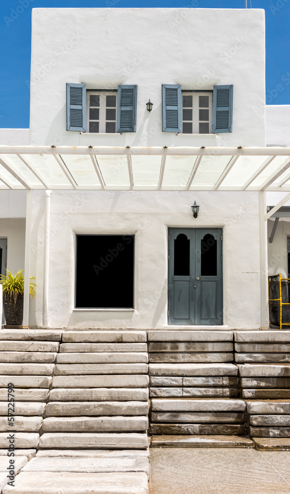 gray door on white wall and cement Staircase gray door on white wall and cement Staircase