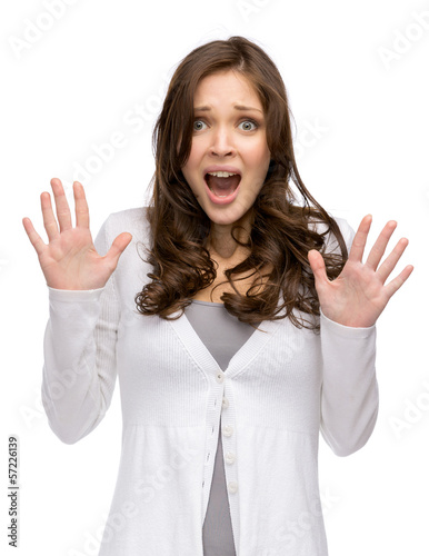Vászonkép Half-length portrait of shocked woman with hands up, isolated