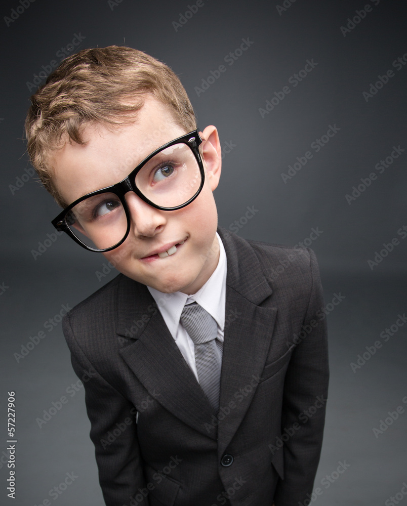 Wide angle portrait of little pensive businessmen in glasses