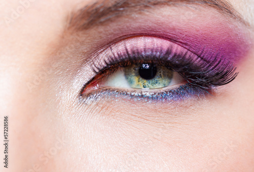 Close up of female eye with bright pink make-up