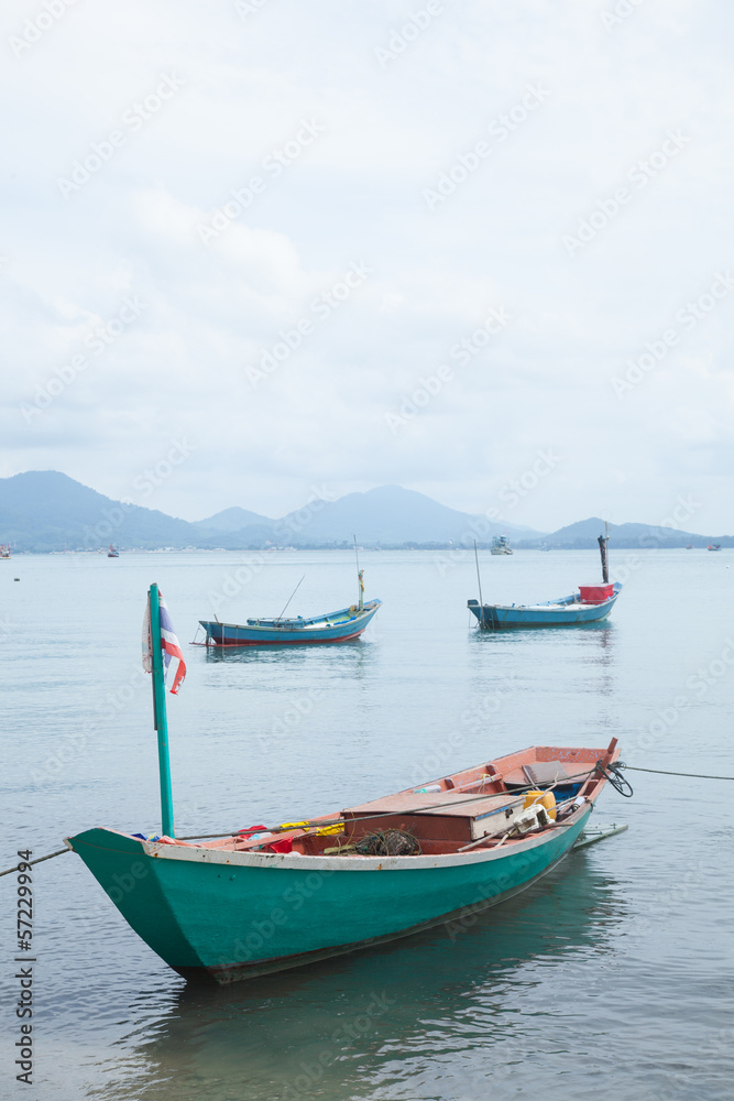 Fishing boats moored at the shore.