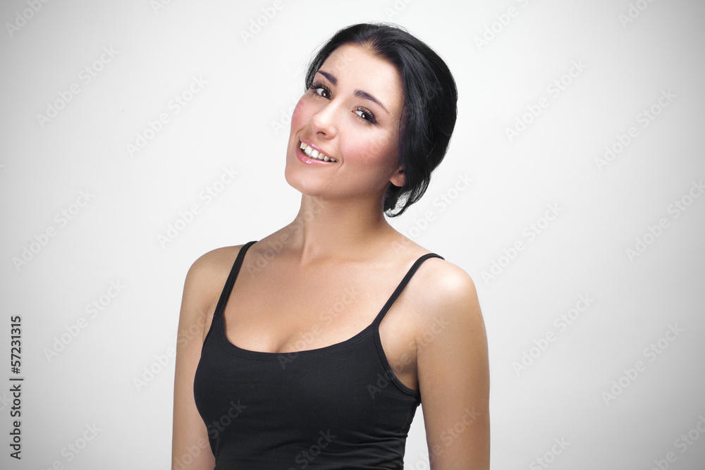 Portrait of young cheerful woman on grey background Portrait of young cheerful woman on grey background