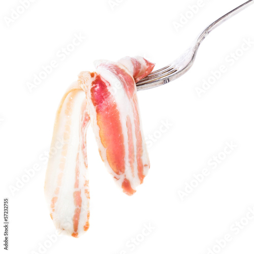 Delicious parma ham on silver fork isolated on white background, photo