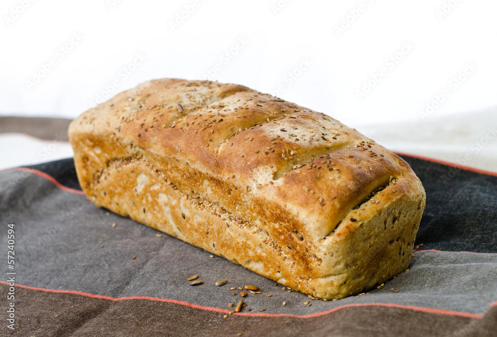 One loaf of bread on tablecloth