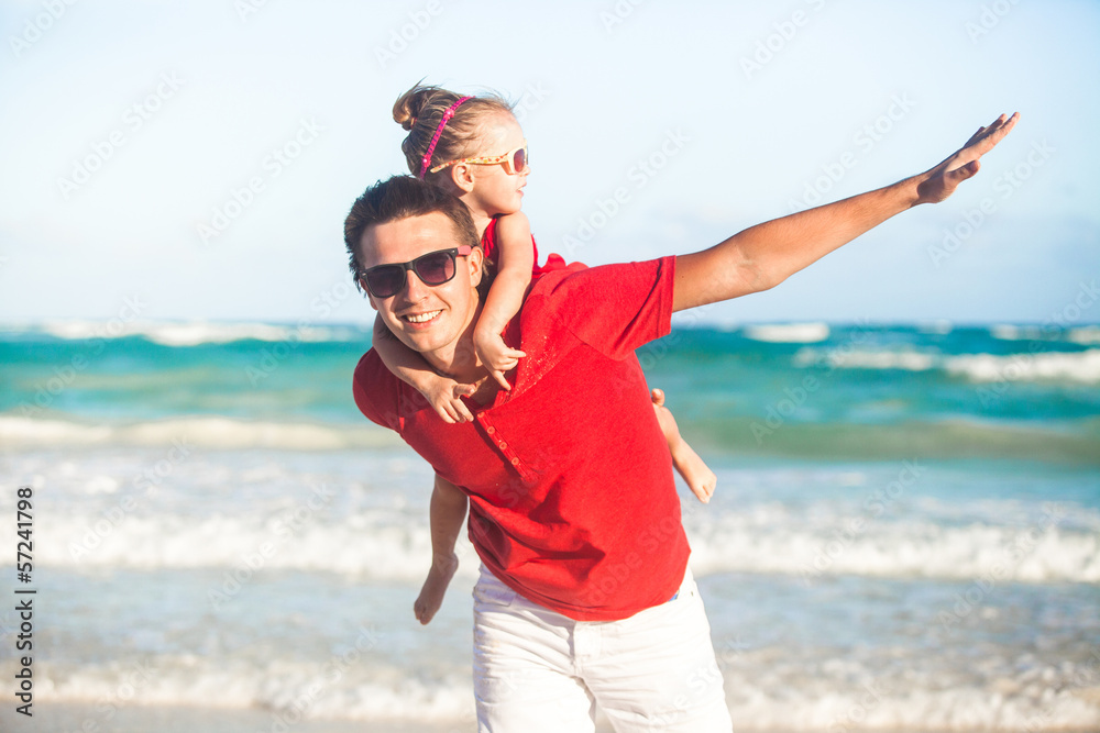Young father and his adorable little daughter flying like a bird Young father and his adorable little daughter flying like a bird